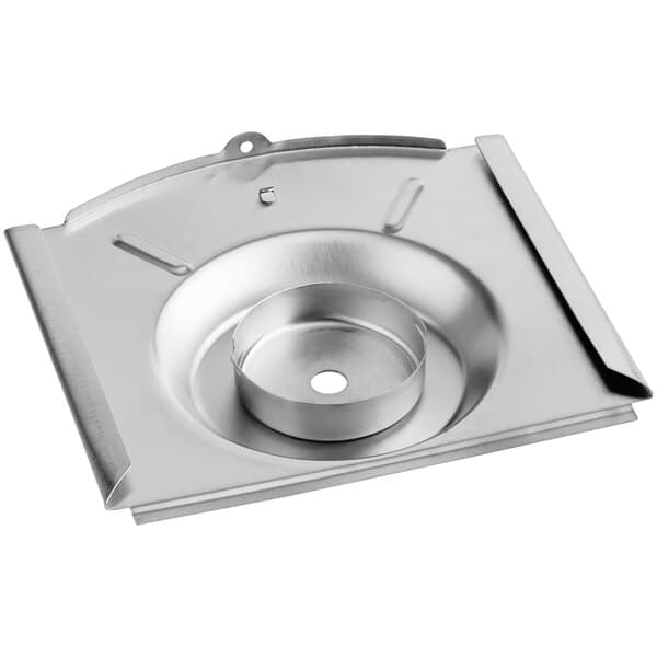 A stainless steel metal plate with a round hole.