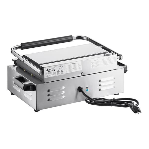 A silver rectangular electric grill with black handles.