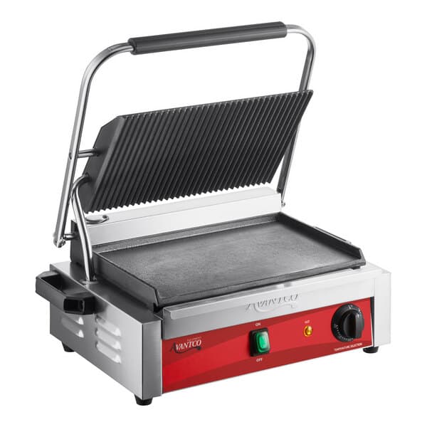 An Avantco commercial panini grill with grooved and smooth plates on a table in a professional kitchen.