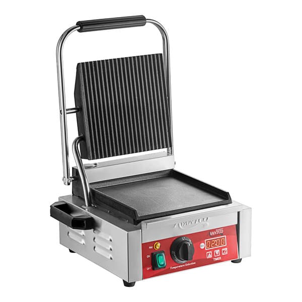 An Avantco commercial panini grill on a counter with a griddle on it.