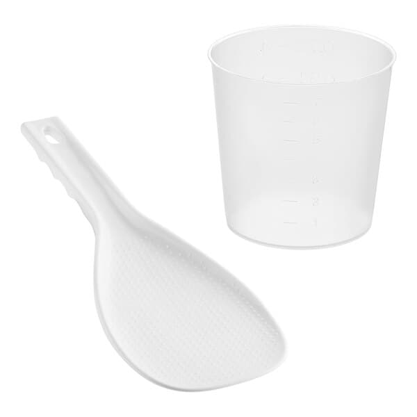 A white plastic spoon and measuring cup.