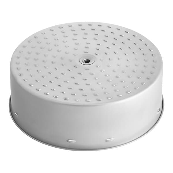 A silver circular brew basket with holes.