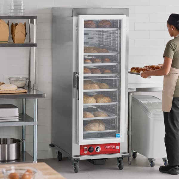 A full size vacuum-insulated heated holding cabinet with a clear door, used for keeping baked goods warm.