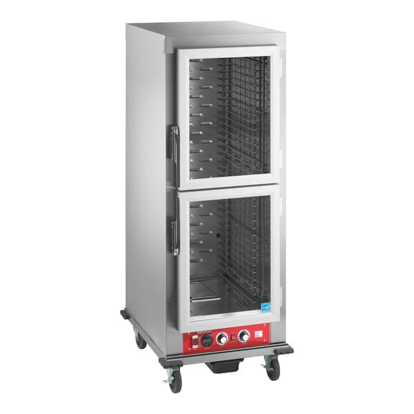 A full size vacuum-insulated heated holding and proofing cabinet with clear Dutch doors and control panel on wheels.