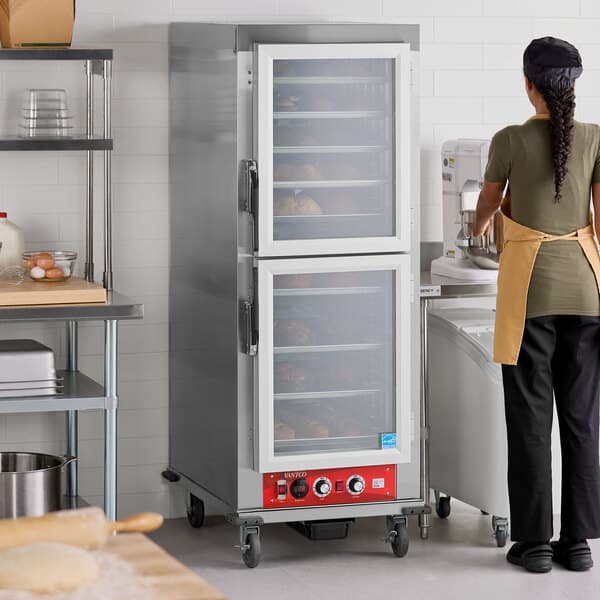 A full size vacuum-insulated heated holding and proofing cabinet with clear Dutch doors.