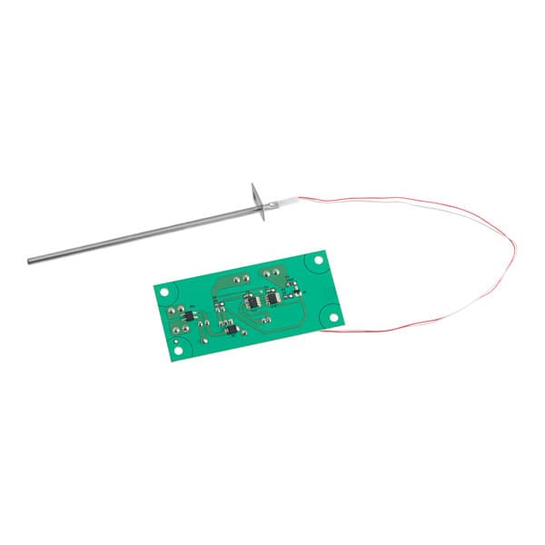 A green circuit board with a red wire.