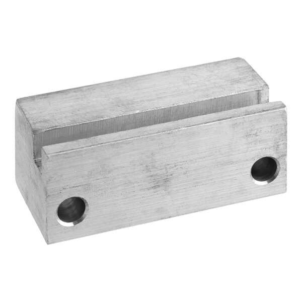 A stainless steel block with two holes.